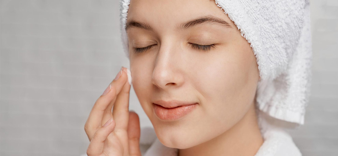 woman applying cream