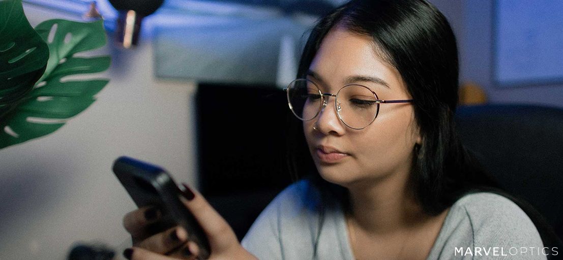 Woman wearing Cheap Prescription Glasses while using cellphone