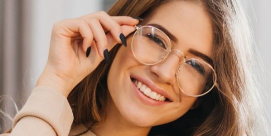 Woman wearing prescription eyeglasses - mportance of Sight and Vision