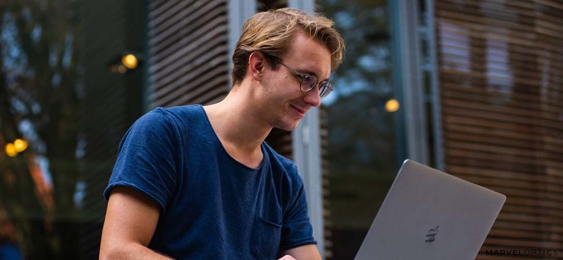 Man wearing blue light glasses