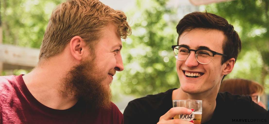 man wearing prescription glasses while having conversation