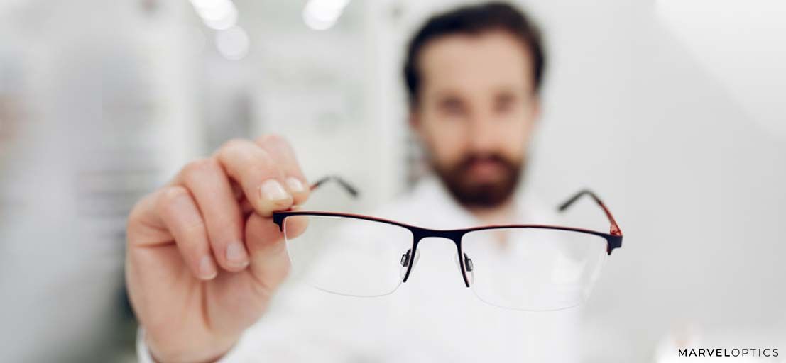 man holding glasses