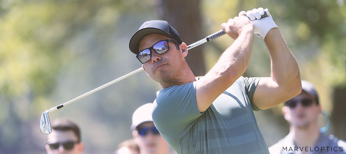 Man wearing Nike sunglasses while playing golf